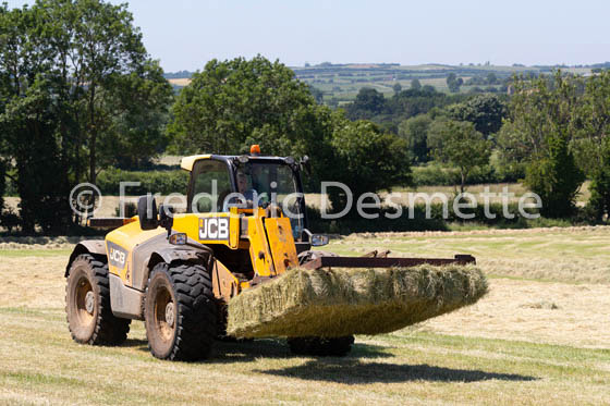 tractor moving hay-94