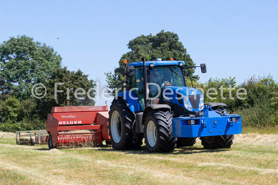 Tractor bailling hay-97